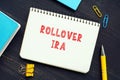 Financial concept meaning ROLLOVER IRA Individual Retirement Accounts with sign on the piece of paper. AÃÂ rollover IRAÃÂ ÃÂ is a